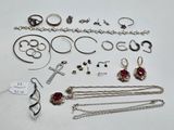 several different types of jewelry are displayed on a white surface
