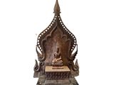 an image of a statue of a buddha sitting on top of a table