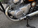 a close up of a motorcycle engine on a street