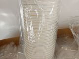 a stack of plastic cups in a box on the floor
