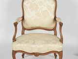pair of louis xv style carved wood armchairs with upholstered upholstered arms