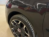 a close up of a car ' s tire with a sticker on it