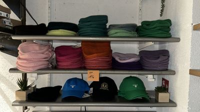 many hats on the shelves in the store