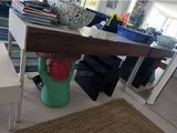 a table with a vase on top of it in a living room