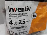 a bag of screws on a table with a price tag