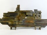 an image of a sculpture of a boat made out of metal