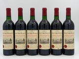 six bottles of red wine are lined up in a row
