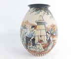 a vase with a picture of a man and a woman on it