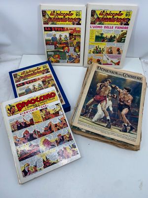 five vintage comic books on display on a white surface
