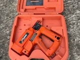 an orange box with a stapler and a stapler in it