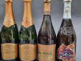 six bottles of champagne are lined up in a row