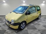 a picture of a small yellow car parked in a garage