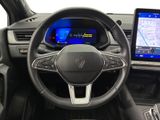 the interior of a car with a steering wheel, dashboard, and a tablet