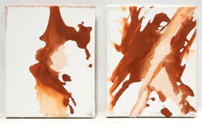 two paintings of brown and white paint on a white surface