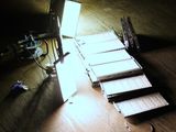 a lot of lights that are on a wooden table
