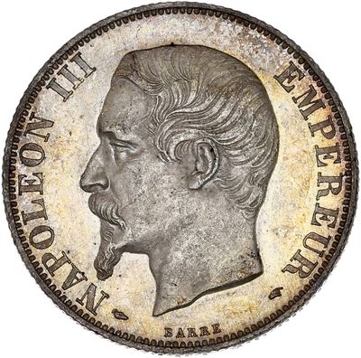 Gros plan sur une pièce de monnaie portant le visage d'un homme