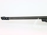 a close up of a rifle on a white surface