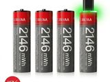 three aa batteries with a green light on top of them