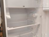 an open refrigerator with a lot of food inside of it