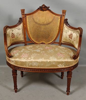 an old fashioned chair with a floral upholstered seat