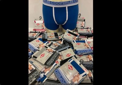 a picture of a pile of money with a man ' s underwear on it