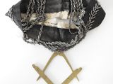 a black and white photograph of a bag with chains on it