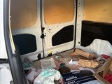 a white van with many items in the back of it