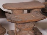 three wooden stools that are sitting on a table
