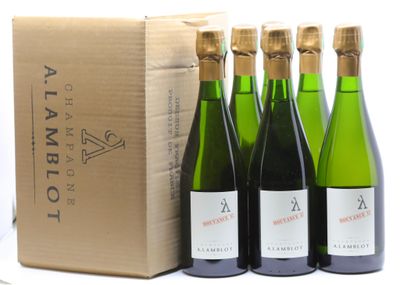 three bottles of wine are sitting next to a box of wine