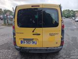 a yellow van that is parked on the side of the road