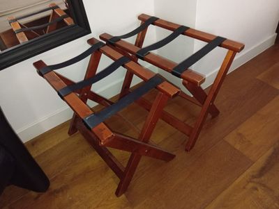 two folding chairs sitting next to a mirror on the floor