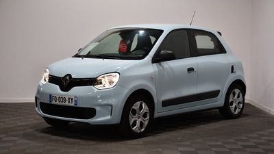 a picture of a small blue car parked in a room