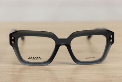 the glasses are made of plastic and have a black frame