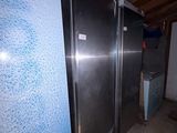 a picture of a refrigerator in a room with a blue wall