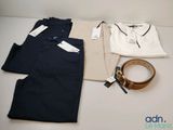 men ' s clothing and accessories are laid out on a table