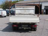 a white truck that is parked in a parking lot