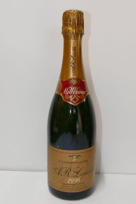 a close up of a bottle of wine on a table