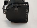 a black camera that is sitting on a white table