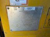 a sign on the side of a yellow machine