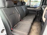 a seat in the back of a van that has two rows of seats