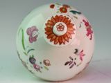 a white ball with a flower design on it