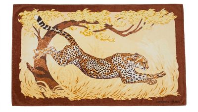 a close up of a rug with a cheetah on it