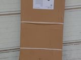 a cardboard box sitting on the ground next to a garage door