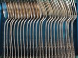 a lot of spoons and forks in a blue box