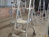 many ladders that are sitting in a building