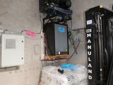 a picture of a forklift in a storage room