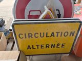 a sign that is sitting on top of a pile of boxes