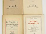 four books of french literature are stacked on top of each other