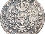 a close up of a coin with a crown on it