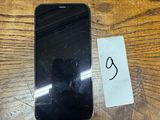an image of a cell phone sitting on top of a wooden table